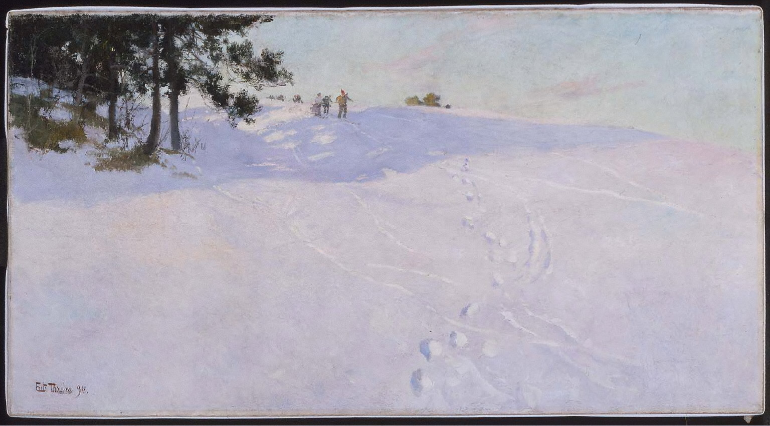 Skiers at the Top of a Snow-covered Hill