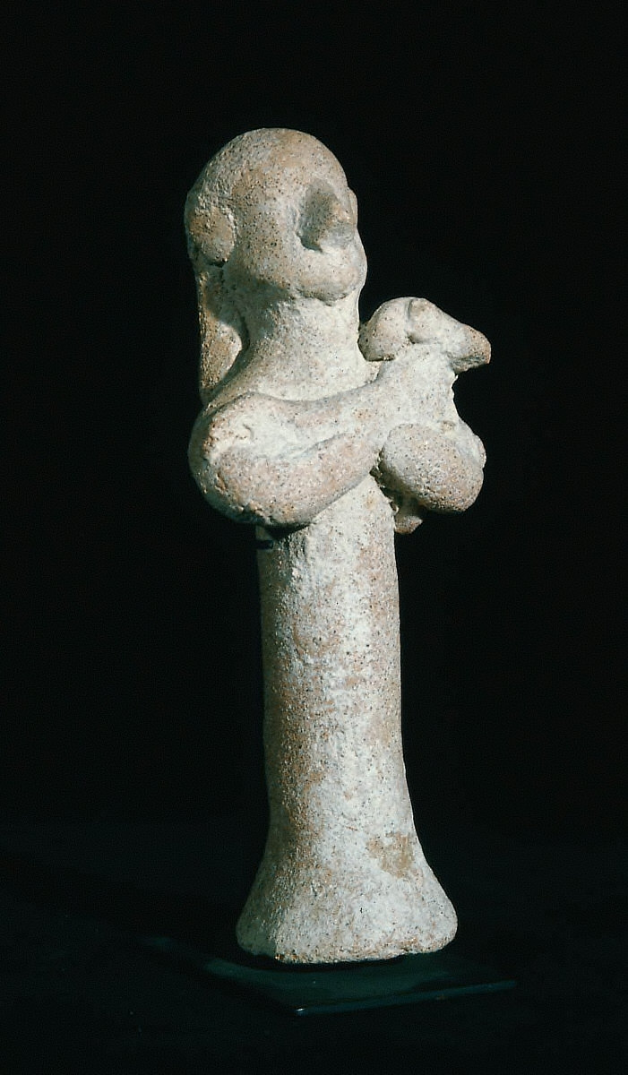 Figure holding a lamb