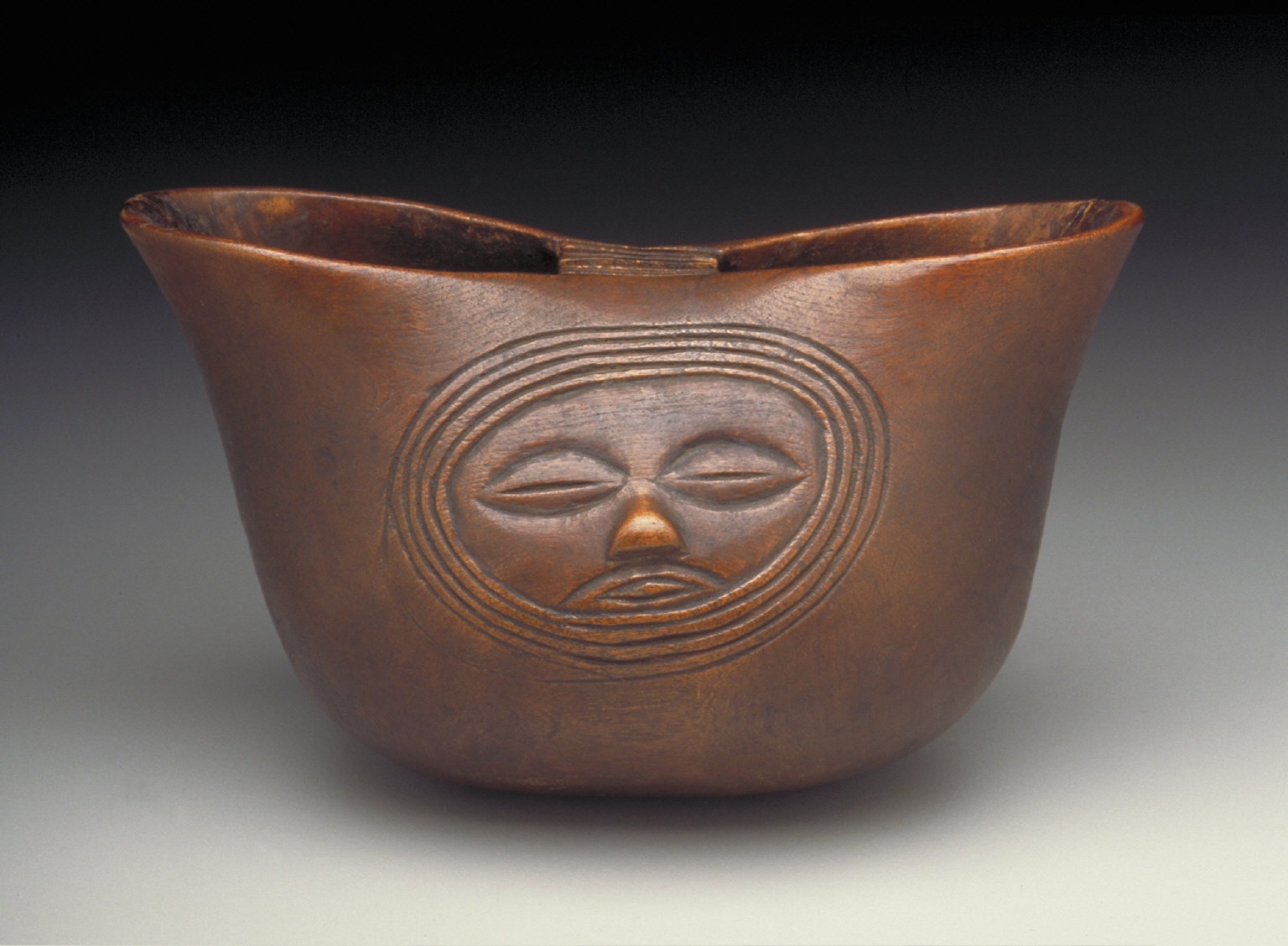 Two-lipped Cup with Faces in Relief