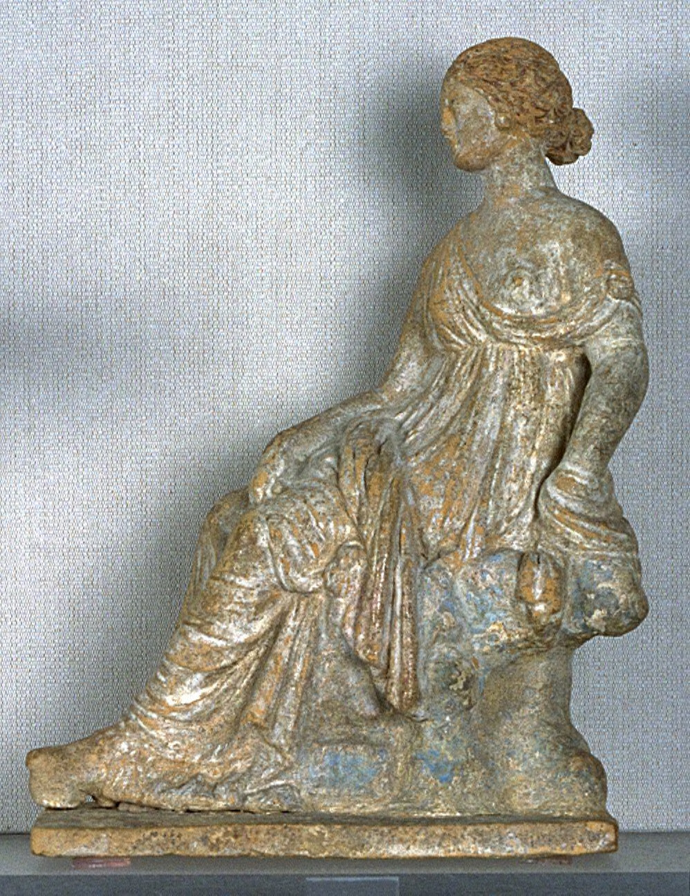 Woman Seated on a Rock